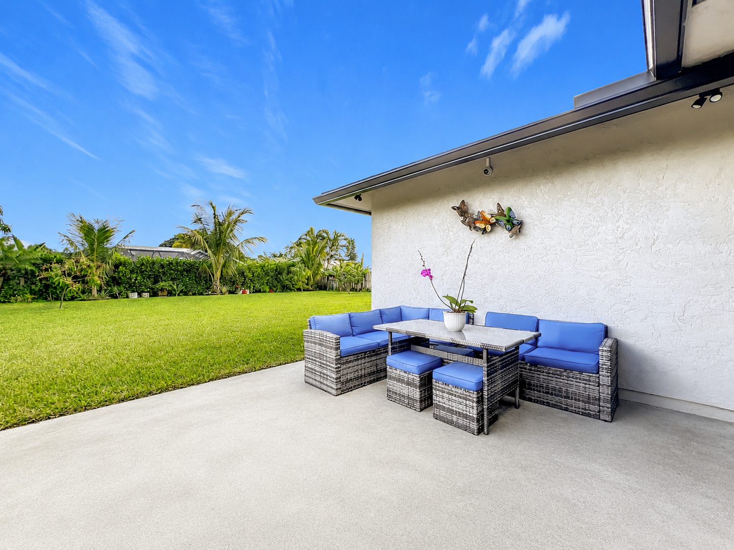 Beautiful sun-drenched backyard patio at Abundant Care Residence